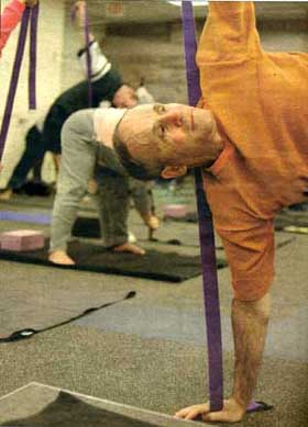 Fr. Thomas Ryan in a Yoga handstand